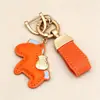 Consigue inmediatamente llavero colgante de dinero personalidad creativa colgante de cuero exquisito para hombres y mujeres pareja bolsa llavero de coche