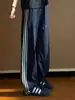 Pantalones casuales de pierna recta a rayas retro, de secado rápido, para hombre, estilo streetwear moderno y a la moda, corte holgado, versátiles y con buena caída.