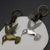 Chaveiro criativo masculino liga pássaro vintage tecido couro de vaca chaveiro bronze