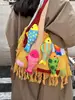 Colección de otoño 2026 transfronteriza: bolso de hombro tejido de gran capacidad, bolsa de compras versátil y bolso tote para el trabajo para llevar bajo el brazo