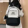 Nueva Mochila Escolar para Estudiante de Secundaria Femenina Gran Capacidad Estampado de Letras Versión Coreana Color de Contraste Hombros de Estudiante Universitario