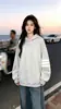 Sudadera con capucha a rayas de manga larga de diseño de nicho moderno estilo coreano para mujer, nuevo top versátil casual de otoño e invierno