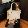 Bolso tipo bandolera moderno retro para chica, bolso tipo concha, bolso cubo, bolso cruzado de alta gama europeo y americano, bolso de hombro estilo estudiante universitario para mujer