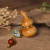 Colgante de calabaza tallada hecho de madera de ciprés chino, un artículo decorativo para coches, bolsos y como adorno decorativo