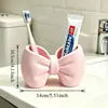 Portacepillos de dientes con forma de lazo superventas transfronterizo, estante para cepillo de dientes y pasta de dientes de lavabo, soporte de almacenamiento, organizador de cepillos de dientes de escritorio