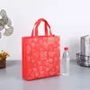 Bolsa de regalo de Año Nuevo, bolsa de regalo festiva de Año Nuevo, bolsa de mano de tela no tejida roja para cigarrillos, vino, té, bolsa para banquetes, hecha a medida