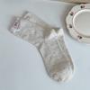 Otoño e invierno estilo académico coreano calcetines de algodón nuevo color punto hilo lazo tela calcetines tubo estándar calcetines de felpa niños