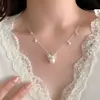 Pendientes de Perla con Lazo Suave de Hada Francesa Románticos Clavos de Oreja Huecos de Nicho de Gama Alta Exquisitos Accesorios para Pendientes