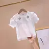 Nuevas Camisas de Manga Corta para Niñas Verano 2026 Estilo Coreano Tops con Cuello de Muñeca Elegantes Camisas Blancas para Niños con Mangas Abullonadas