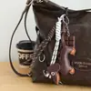 Colgante Perro Salchicha Estilo Miu Bolso de Cuerda Tejida Colgante para Bolso de Pareja Llavero Lindo Colgante Escalada Montaña Vintage Ins
