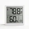 Mini Medidor Eletrônico de Temperatura e Umidade para Comércio Exterior, Pode Ser Usado como Suporte ou Montado na Parede com Ímã, Termômetro e Higrômetro Inteligente com Rosto Sorridente Cx1202