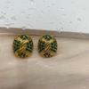 Estilo europeo y americano retro nuevo diamante verde oro lujo ligero aretes de botón ovalados personalidad de alta gama combinable joyería para la oreja