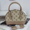Bolso de concha de nicho estilo francés vintage para mujer, Nuevo de moda 2025 estilo Hong Kong material de retazos bolso de hombro y cruzado para mujer