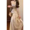 Nuevo Traje de Chaleco Dorado Estilo Chino Nacional con Falda para Mujer, Moda de Verano Conjunto de Dos Piezas de Top Botonado de Gama Alta y Falda Media