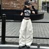 Traje de overol para niños primavera y otoño 2025 nuevo estilo niñas otoño pantalones casuales niños grandes camisa de manga rota para base