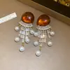 Pendientes de borla con carcasa de madera marrón transfronterizos europeos y americanos, pendientes de estilo vintage Maillard, pendientes de mujer de lujo ligero de alta gama
