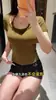 Camiseta de manga corta ajustada para mujer, nuevo diseño de verano, estilo americano, efecto dos piezas, pura y sexy, cuello halter, top de hombro normal