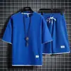 Traje deportivo casual de punto gofre para hombre, fresco y moderno para el verano, conjunto holgado de manga corta y pantalones cortos, atuendo elegante