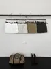 Saia Curta A-Line Han Xun Light Estilo Retro Americano de Cintura Alta Emagrecedora com Bolsos Workwear Tridimensionais para Mulheres, Novo Estilo Outono 2026 27197