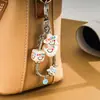 Cadena Personalizada Nueva de Hueso de Serpiente de Metal Colgante Decorativo para Bolso Creativo Cara Sonriente Cuadrada Llavero con Colgante de Perlas