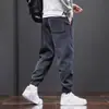 Pantalones casuales engrosados para hombre, nuevos pantalones deportivos tipo jogger de pana cálida para hombre con retazos, modernos y versátiles