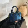 Bolsa Boston jeans color blocking popular deste ano para mulheres 2026 novo estilo bolsa de mão versátil elegante bolsa de ombro bolsa transversal