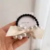 Nuevo Anillo para el Cabello Estilo Retro Chanel Gran Señorita Cuerda para el Cabello Estilo Francés Hepburn Cuerda para el Cabello Corea del Sur Perla Lazo Accesorios para el Cabello para Mujeres