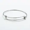 Venta Directa de Fábrica moda simple elástico push-pull actividad telescópico acero de titanio pulsera hombres y mujeres pulsera ajustable al por mayor