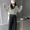 Ropa interior con capucha a rayas para niños Otoño 2026 Nuevo Estilo Coreano para Niños Mediano/Grande Moda Infantil Conjunto de Tres Piezas Primavera/Otoño Moderno