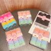 90 lindas bandas elásticas para el cabello para bebés, en caja, sin costuras, de goma, color caramelo, venta al por mayor