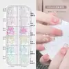 Caja de Decoraciones para Uñas Flor de Cinco Pétalos Diamantes de Imitación Planos Mixtos Remaches de Resina Aurora Lazo Flor de Camelia Diamantes de Imitación Decorativos