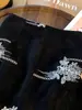 Falda corta vintage de lentejuelas con bordado pesado para mujer, otoño 2026 nueva falda corta de cintura alta adelgazante línea A A14154