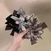 Diadema de lazo trenzado de diseño de nicho estilo coreano para moño que realza el volumen, Cuerda para coleta de alta gama para mujer