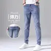 Calça Jeans Masculina de Verão Elástica Perna Reta Longa Estilo Coreano Moda Slim Fit Perna Afunilada Calças Casuais Masculinas de Cintura Média