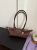 Bolso Estilo Coreano Nicho Retro Gamuza Mango Largo Baguette Mujer 2026 Nuevo Versátil Gran Capacidad Hombro Único Axila