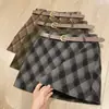 ¡Nicho de estilo coreano! Falda de mujer de otoño 2026, estilo vintage artístico, de cintura alta, con estampado de rombos retro