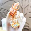 Chaveiro Urso Sonhador Desenho Animado Areia Movediça Menina Boneca Leite em Pó Casal Fofo Pingente de Bolsa Pequeno Presente Atacado