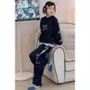 Conjunto de Otoño para Niñas con Lazo 2026 Nueva Moda Dos Piezas Sudadera y Pantalones de Pierna Ancha Ropa Deportiva para Niños Mayores