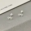 Pendientes de Nudo de Lazo de Plata Pura S999 Estilo Coreano Líneas Suaves y Dulces Moda Simple Versátil Pendientes de Diseño de Nicho