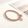 Nueva oferta especial pulsera de acero inoxidable con cuentas y colgante de cruz transfronteriza, alta calidad para mujer, cuenta redonda, acero de titanio, cordón elástico