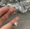 Colar de Engrenagem Giratória Estilo V Jinbao Banhado a Ouro 18K Cerâmica Preta e Branca Diamante Três Anéis Corrente de Clavícula Versátil de Alta Qualidade