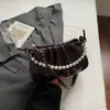 Bolso de Axila Plegado de Nicho Estilo Coreano para Mujer Moda Otoño 2025 Estilo Cadena de Perlas Bolso de Hombro Cruzado para Viajar