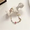 Pulseira Estrela e Lua Estilo Coreano dz para Mulheres Exquisita Cravejada com Strass Fashionable Pérola Estrela de Cinco Pontas Joias de Mão Doce Fresca Ornamentos de Toque de Alto Padrão