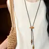 Collar con Colgante Redondo de Corazón con Cuentas de Madera de Cáscara de Coco Cadena para Clavícula Estilo Étnico Retro Cadena para Suéter Diseño de Nicho