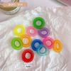 Venta al por mayor de fábrica Accesorios para el cabello coreanos Tocado Anillo de soporte para teléfono Pulsera Cuerda para el cabello de color caramelo Banda de goma de cable de teléfono Cuerda para la cabeza