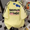Camiseta Ins Estilo Americano com Estampa de Letras Tendência Manga Curta Unissex Verão 2025 Streetwear Solta Casual Casal