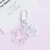 Llavero con hebilla de puerta giratoria, colgante de pentagrama y corazón transparente de colores, accesorio hecho a mano para bolsos