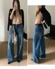 Nuevo TOP de Otoño Estilo Europeo Guangzhou Trece Líneas Flecos Degradados Artesanía Vaqueros de Pierna Ancha en Capas con Cinturón 82595