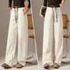 Pantalones de lana de pierna ancha color albaricoque para mujer, nueva colección otoño/invierno 2026, de tiro alto, mezcla de lana y acetato, pantalones casuales con una silueta fluida y curva