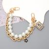 Yilian novo estilo Chanel Pérola cadeia portátil dupla cadeia pulseira pulseira caixa de telefone chaveiro-cadeia resistente a quedas atacado